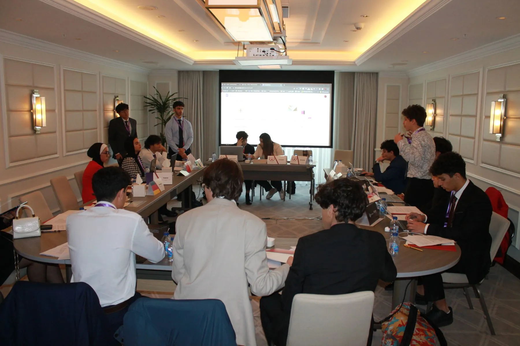 HTUMUN delegates voting during committee session